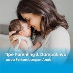 Seorang ibu memeluk bayinya dengan penuh kasih, menggambarkan kedekatan emosional dalam penerapan tipe parenting yang hangat dan responsif.