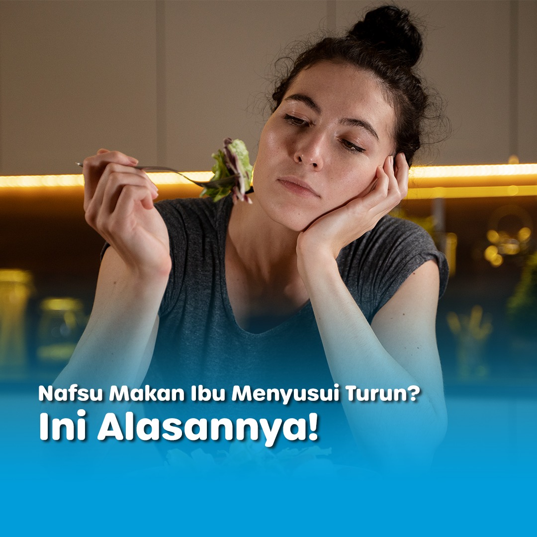 Perempuan tampak lesu menatap salad di garpu, menggambarkan nafsu makan ibu turun saat menyusui.